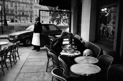 Couple Kissing at Sidewalk Cafe